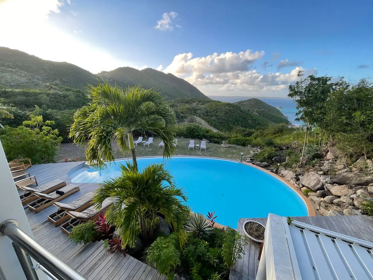 A hillside pool looking toward the sea.